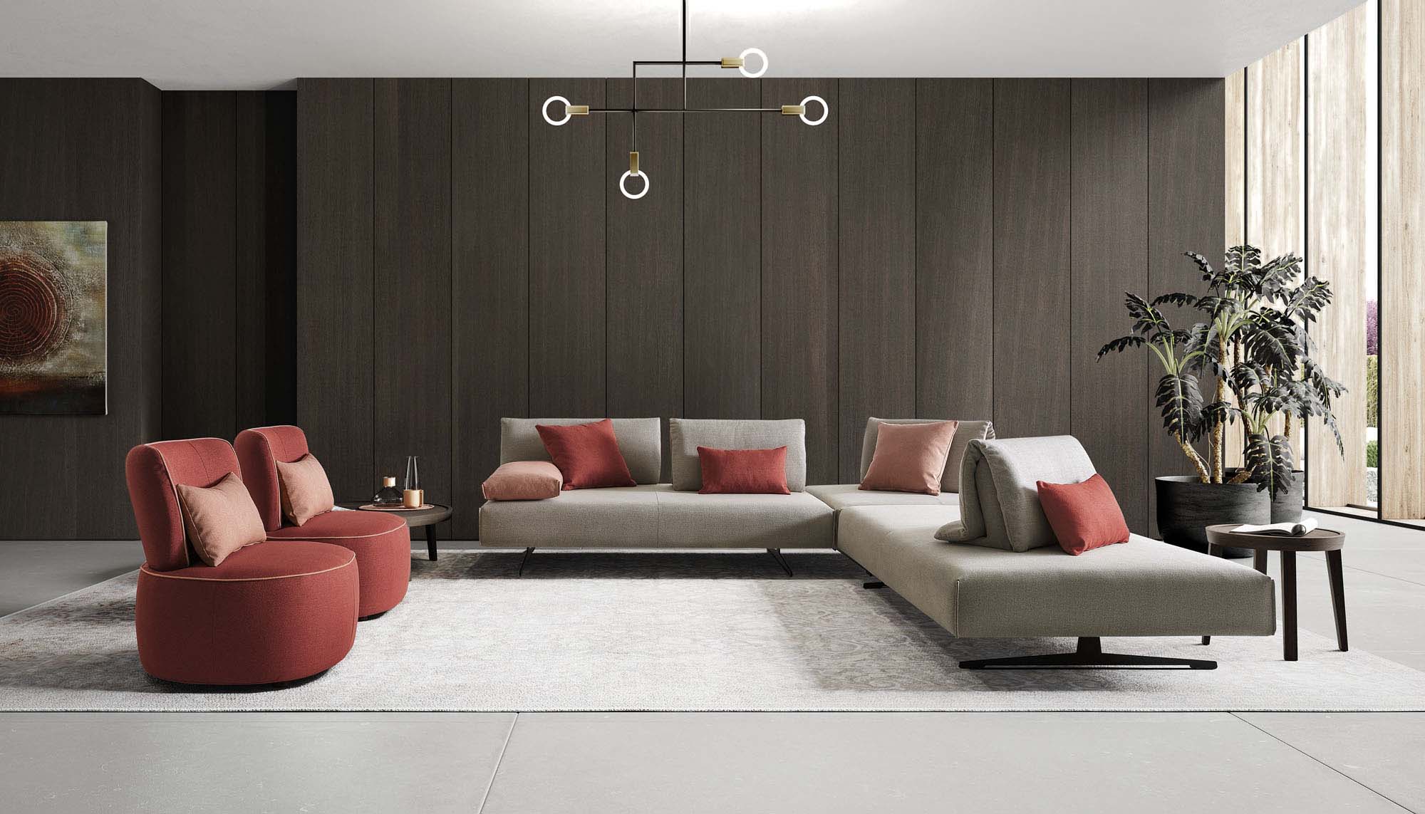Ampio soggiorno moderno arredato con divano di design a L e due poltrone