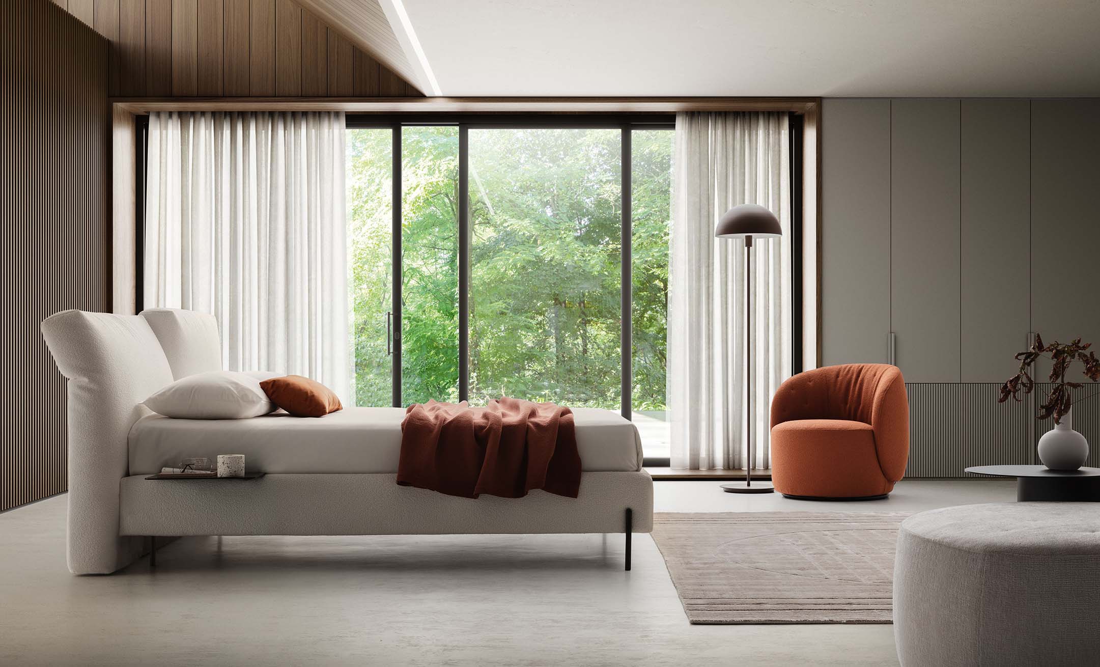 Stanza moderna arredata con letto bianco con testiera regolabile
